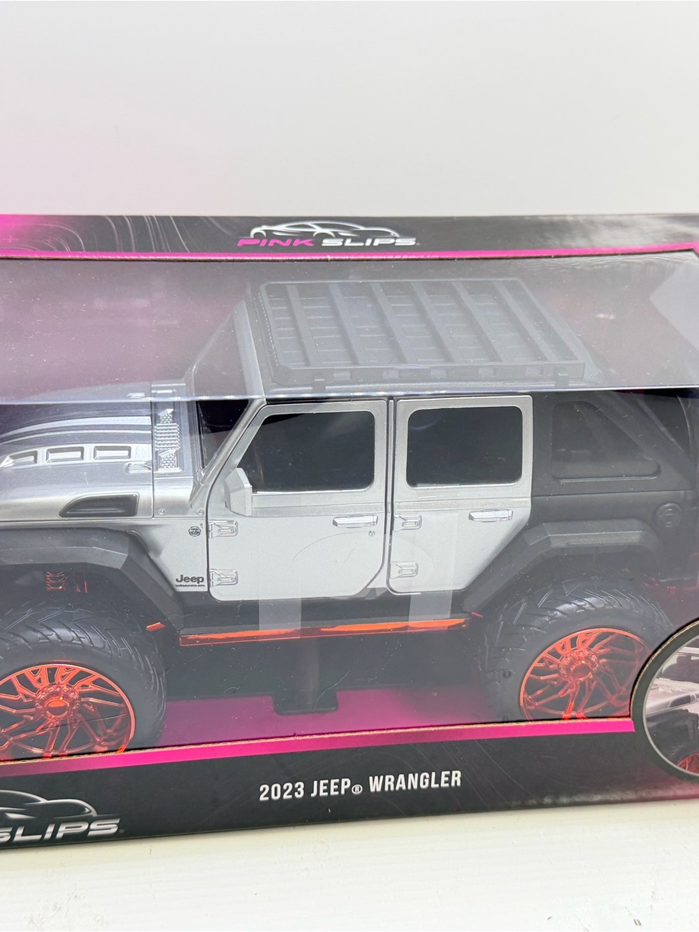 Jada pink slips 2023 Jeep Wrangler Kids Toy - Silver with Orange Accents